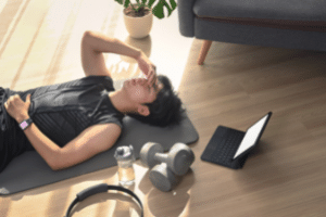 Man lying on the floor exhausted after exercise 
