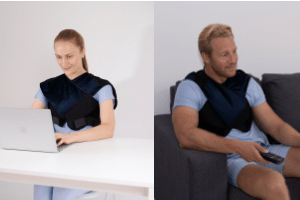 Woman in front of laptop and man sitting on sofa wearing Prime Science Fat Burner Vest