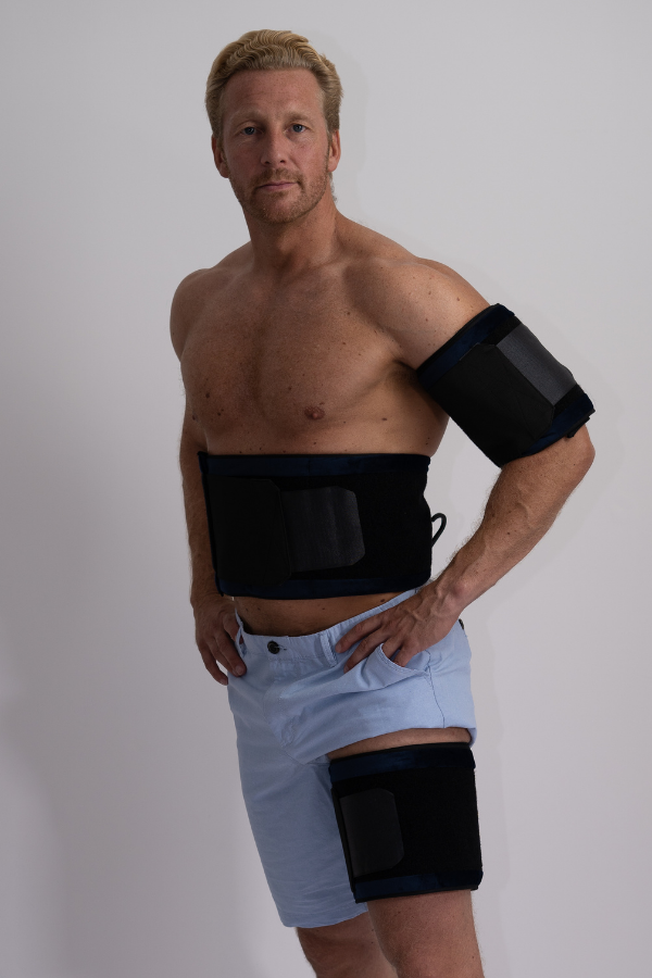 Man wearing fat freezing belt on stomach, thigh and arm