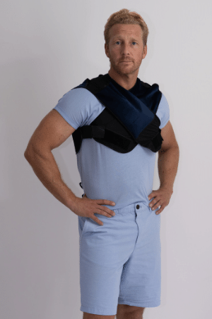 Man standing wearing Prime Science Calorie burner vest over shoulders